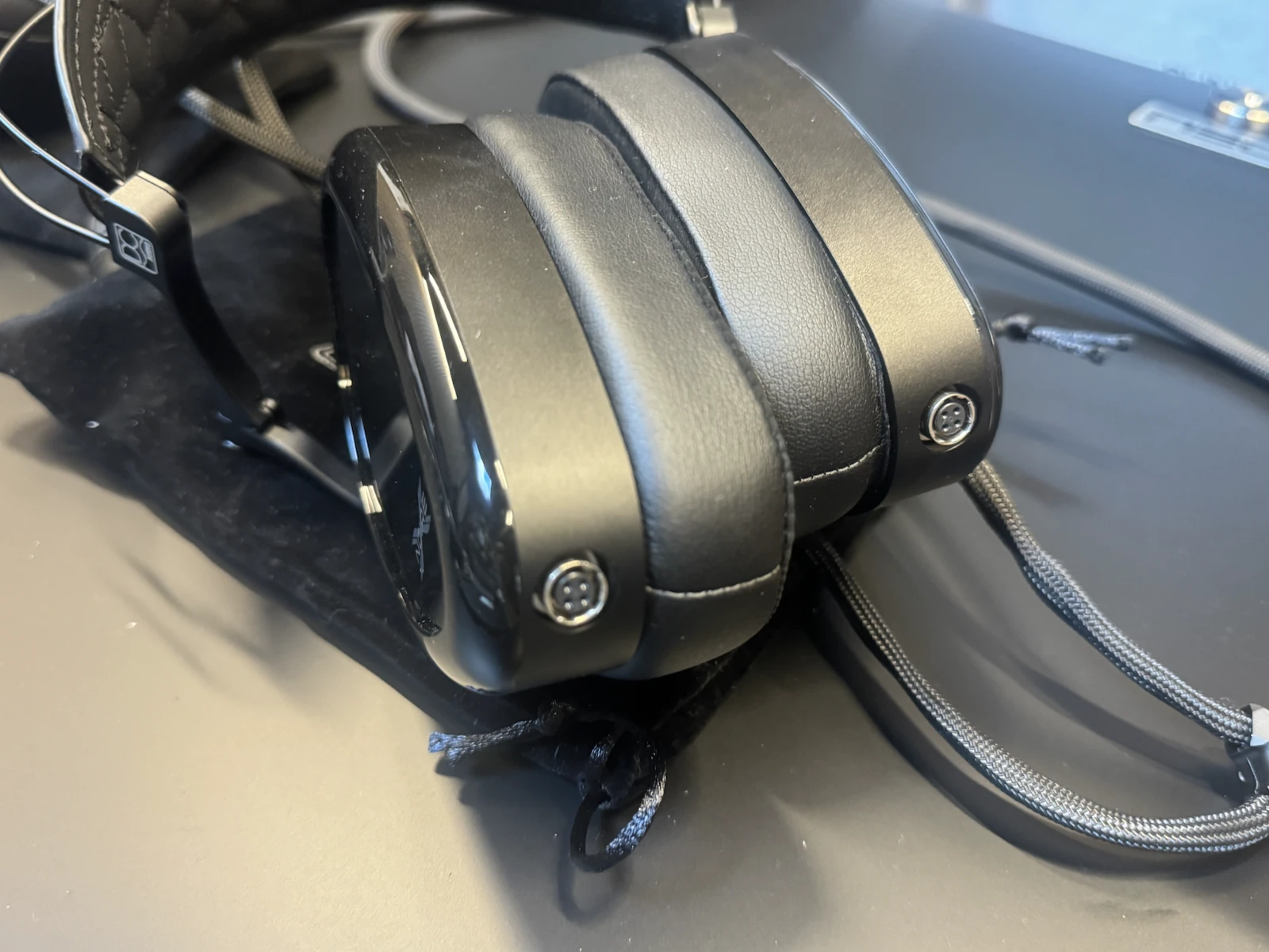 Dan Clark Audio NOIRE X headphones showing the cable connection sockets for balanced and unbalanced cables