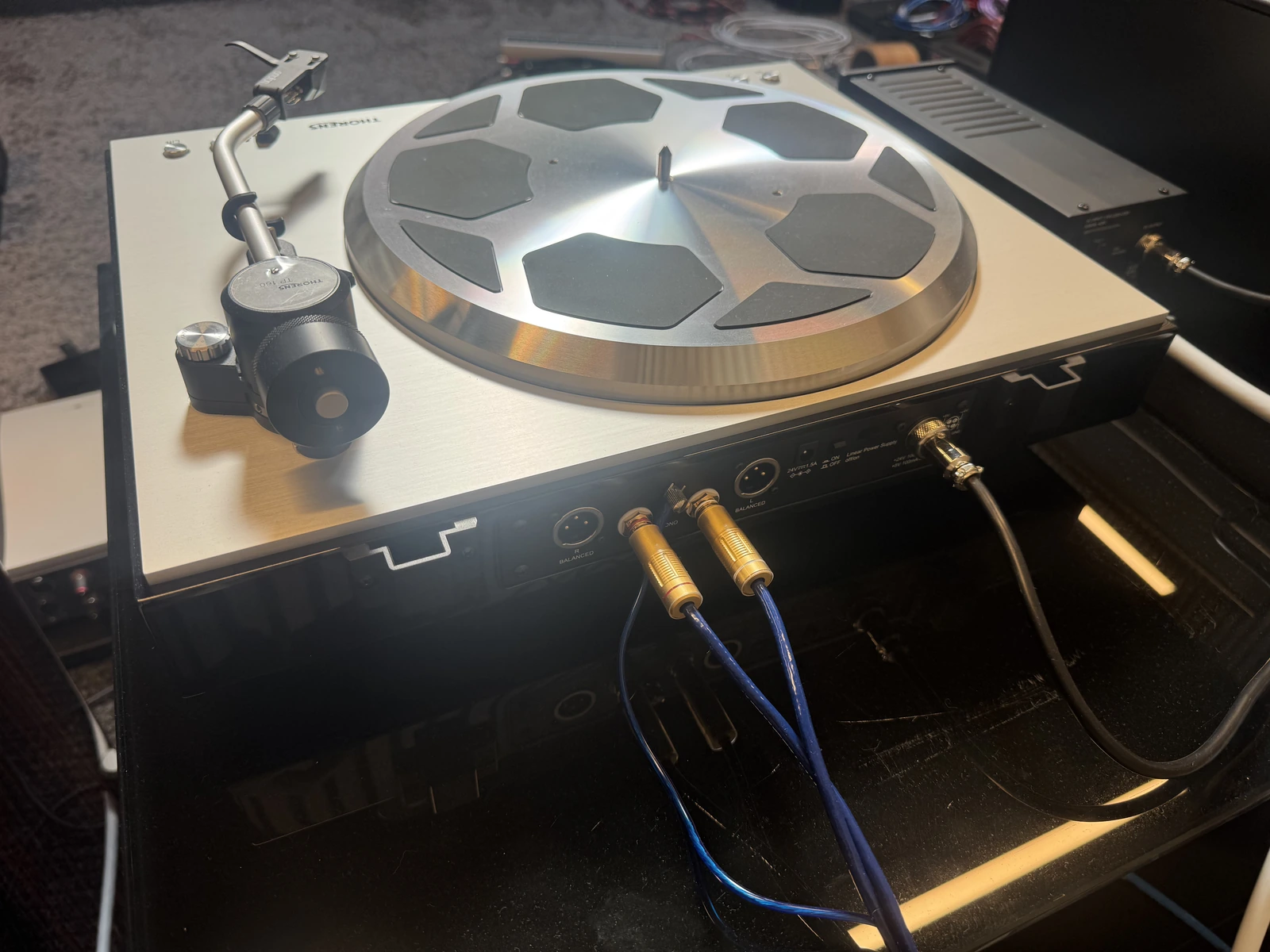 Thorens TD 404 DD rear panel showing RCA and balanced XLR outputs with connected audio cables